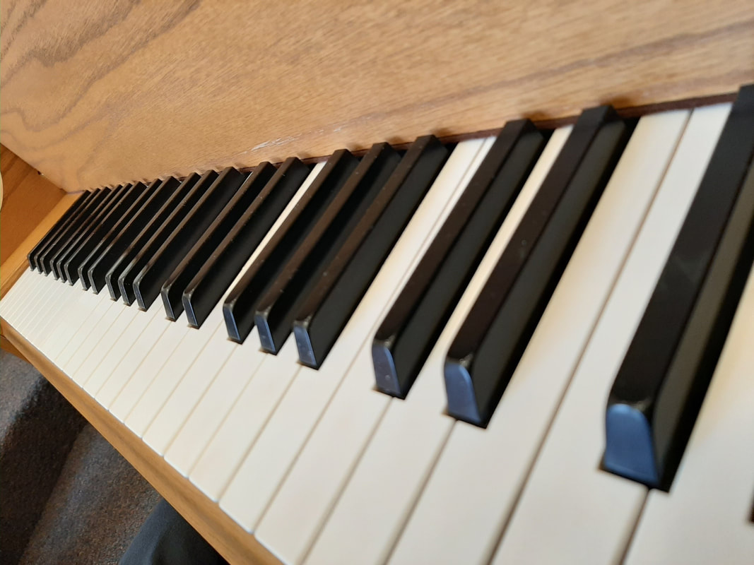 Doctor Octave's Piano Services - grand piano detail with tuning lever