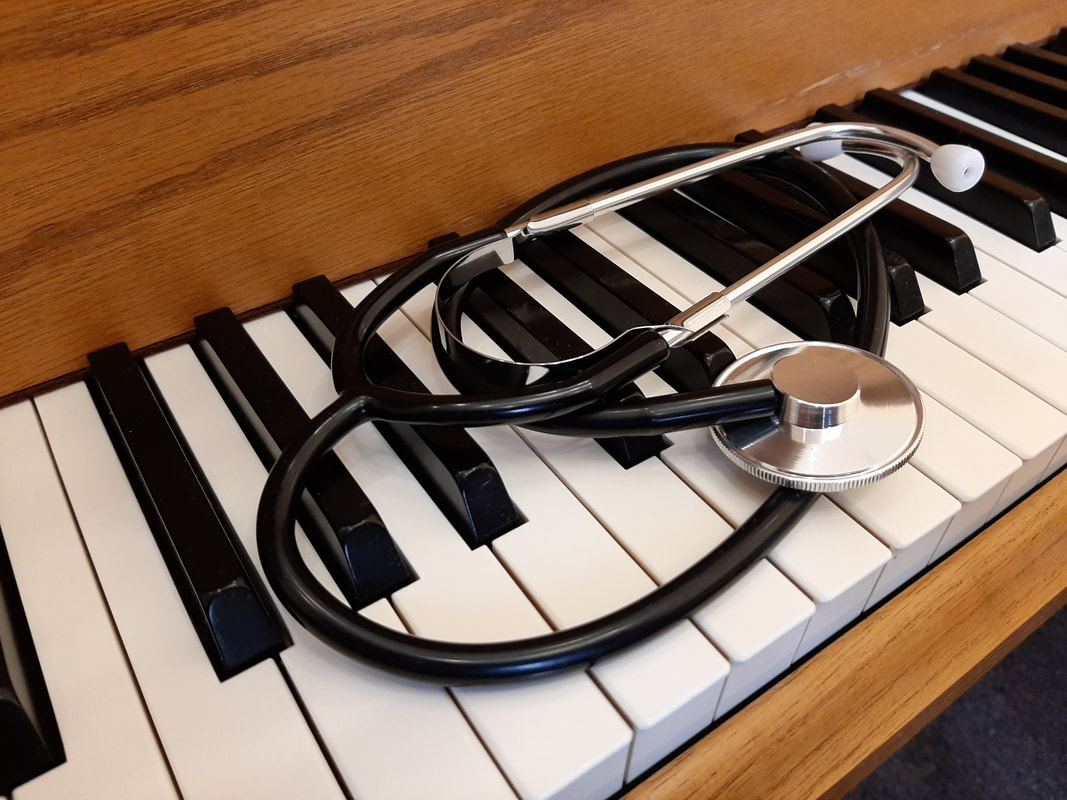 Doctor Octave's Piano Services - piano keyboard with stethoscope